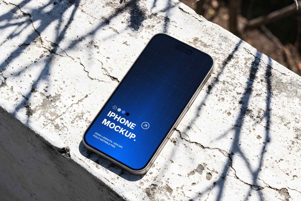 Free iPhone 15 Pro on Concrete Ledge Mockup | Mockup Space