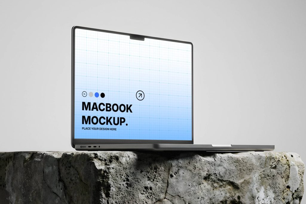 Free MacBook on Rock Mockup for UI Presentation | Mockup Space